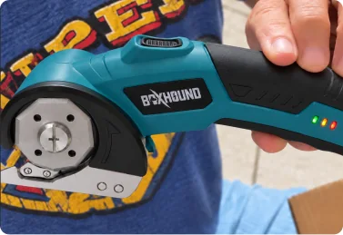 Verified Boxhound customer holding the Electric Box Cutter