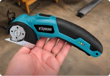 Verified Boxhound customer holding the Electric Box Cutter